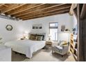 Cozy bedroom features a queen bed, decorative pillows, and natural light at 701 W Trinity Ave # 116, Durham, NC 27701