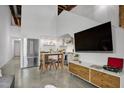 Open concept living room featuring a modern island with stools at 701 W Trinity Ave # 116, Durham, NC 27701