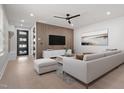 Bright living room featuring sleek furniture, modern wood accent wall, and contemporary design elements at 730 Hopkins St, Durham, NC 27701