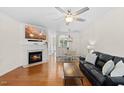 Inviting living room featuring a fireplace and hardwood floors at 7613 Satinwing Ln, Raleigh, NC 27617