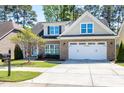 Lovely brick home boasts a two-car garage, beautiful landscaping, and well-kept lawn at 837 Varina Ln, Fuquay Varina, NC 27526