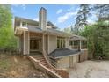 Striking home with a chimney and attached two car garage at dusk at 1011 Wood Sage Dr, Chapel Hill, NC 27516