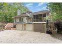 Inviting house with a screened porch and an attached two car garage at 1011 Wood Sage Dr, Chapel Hill, NC 27516
