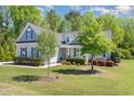 Inviting one-story home with a lush green lawn and mature trees at 1101 Sky Wave Trl, Raleigh, NC 27603