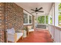 Inviting front porch with cozy seating, a ceiling fan, and a relaxing porch swing for ultimate comfort at 1105 Englewood Ave, Durham, NC 27701