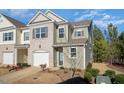 Charming two-story home with a well-maintained yard and attached garage at 1217 Neighborly Way, Morrisville, NC 27560