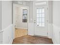 Bright foyer with hardwood floors and access to laundry room at 1217 Neighborly Way, Morrisville, NC 27560