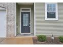 Welcoming entrance of home showcasing the front door and house number at 1217 Neighborly Way, Morrisville, NC 27560