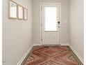 A welcoming entryway featuring a stylish rug and natural light, creating a cozy first impression at 140 Clear Water Rd, Louisburg, NC 27549