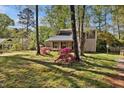 Charming home with lush landscaping and mature trees in a desirable location at 1517 Laughridge Dr, Cary, NC 27511