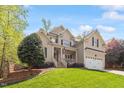 Beautiful home showcasing a manicured lawn and classic architectural details at 317 Okamato St, Raleigh, NC 27603