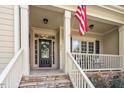 Inviting front porch with stone steps and charming details at 317 Okamato St, Raleigh, NC 27603