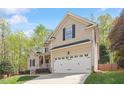Charming two-story home with a welcoming front porch and a two car garage at 317 Okamato St, Raleigh, NC 27603