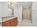 Bathroom with granite vanity, and glass enclosed tiled shower at 400 W North St # 502, Raleigh, NC 27603