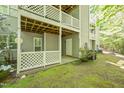 Backyard patio area offering privacy with white latticework and lush landscaping at 407 Gooseneck Dr # A2, Cary, NC 27513