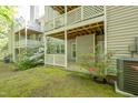 Backyard patio area offering privacy with white latticework and lush landscaping at 407 Gooseneck Dr # A2, Cary, NC 27513