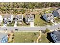 Aerial view of the home and neighborhood, nestled among lush greenery and well maintained roads at 490 Boulder Point Dr, Chapel Hill, NC 27516