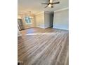 An open living space filled with natural light from the big windows and hardwood floors at 50 Lakewood Dr, Roxboro, NC 27573