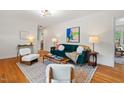 Cozy living room features hardwood floors, a plush sofa, and modern decor at 513 Hugo St, Durham, NC 27704