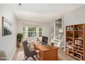 Bright and airy office with a bay window, desk, and bookshelf at 601 E Dynasty Dr, Cary, NC 27513