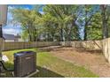 View of the home's private, fenced-in backyard, perfect for entertaining or relaxing at 621 Ray St, Selma, NC 27576