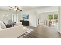 Bright living room featuring modern furniture, wood floors, and an open layout perfect for entertaining at 7120 Guess Rd, Hillsborough, NC 27278
