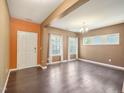 Bright living room with hardwood floors, neutral paint, and an abundance of natural light at 835 Poplar St, Durham, NC 27703