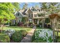 Inviting home with manicured front yard, brick walkway, and flowering shrubs at 944 Alden Bridge Dr, Cary, NC 27519