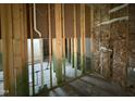 Interior view of the home's wood framing and insulation at 107 Tee Dr, Selma, NC 27576