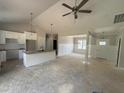 Open floor plan showing bright kitchen with white cabinetry and island at 107 Tee Dr, Selma, NC 27576