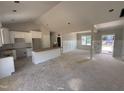 Bright, white eat-in kitchen with a central island and unfinished floors at 107 Tee Dr, Selma, NC 27576