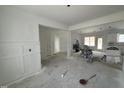 Open-concept interior with white trimwork and views of the kitchen at 107 Tee Dr, Selma, NC 27576