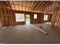 Framing of a home under construction, with windows and a concrete floor at 107 Tee Dr, Selma, NC 27576