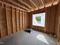 Framing of a room under construction with a window at 107 Tee Dr, Selma, NC 27576