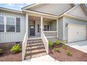 Inviting front porch with brick steps enhances the curb appeal of this charming home at 152 Royal Ave, Selma, NC 27576