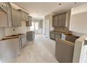 Spacious unfinished kitchen with ample cabinet space and natural light at 152 Royal Ave, Selma, NC 27576