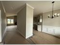 Open concept living space with large windows, fireplace and access to the kitchen at 152 Royal Ave, Selma, NC 27576