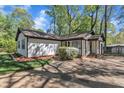 A charming home featuring a well-manicured lawn, and a simple shrub at 1623 Alicary Ct, Cary, NC 27511