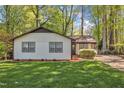 Inviting home with a manicured lawn, a simple landscape design and a neutral color palette at 1623 Alicary Ct, Cary, NC 27511