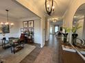Inviting living room featuring modern lighting, neutral paint, hardwood floors, and an abundance of natural light at 164 E Victory View. Ter, Smithfield, NC 27577