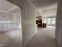 Spacious living room featuring drywall, large windows, and in-progress construction at 172 Royal Ave, Selma, NC 27576