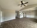 Open living space showcases hardwood floors, high ceilings, and seamless flow to the kitchen at 172 Royal Ave, Selma, NC 27576