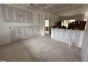 Open-concept living area featuring drywall, and views of other in-progress rooms through the doorway at 172 Royal Ave, Selma, NC 27576