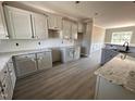 Modern kitchen with granite countertops, new appliances, and ample cabinet space at 192 Royal Ave, Selma, NC 27576