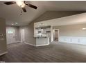 Open-concept living space featuring stylish floors and a kitchen bar at 192 Royal Ave, Selma, NC 27576