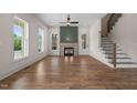 Bright living room with hardwood floors, fireplace, and natural light, creating an inviting atmosphere at 250 Pilot Ridge Rd, Zebulon, NC 27597