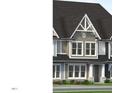 Charming townhome exterior with a dark roof, neutral siding, white trim, and a well-manicured lawn at 3020 White Rail Dr, Fuquay Varina, NC 27526