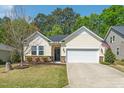 Inviting single-story home with tidy landscaping and an American flag displayed on the front at 3029 Willow Ranch Dr, Fuquay Varina, NC 27526