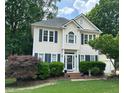 Inviting two-story home with well-maintained lawn and traditional architectural details at 3100 Benton Cir, Raleigh, NC 27615