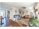 Bright living room with hardwood floors, fireplace, and neutral color palette at 3100 Benton Cir, Raleigh, NC 27615